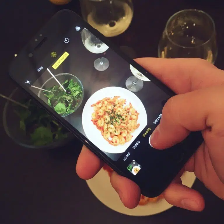 Social Media Marketing using phone to photograph food